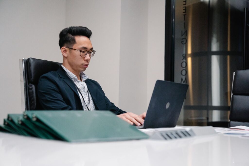 IT administrator managing laptop computers office