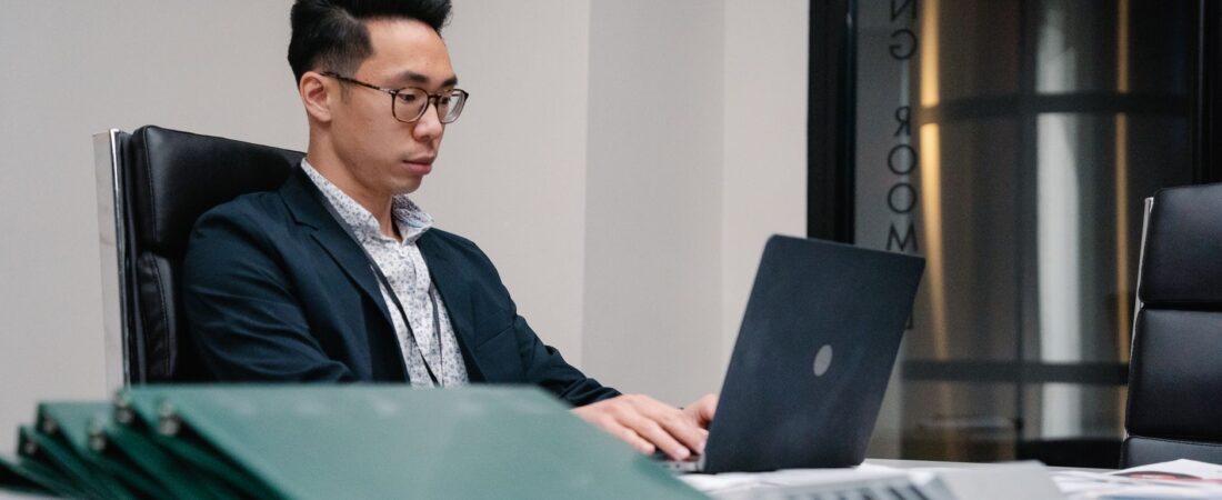 IT administrator managing laptop computers office